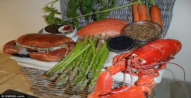The cat food contains, from clockwise: saffron, line-caught Scottish salmon, carrots, quinoa, Arenkha caviar, Norfolk lobster, organic asparagus, and locally-sourced Devon crab