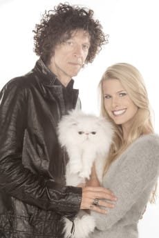 Howard Stern and Beth Ostrosky Stern pose with a kitten.